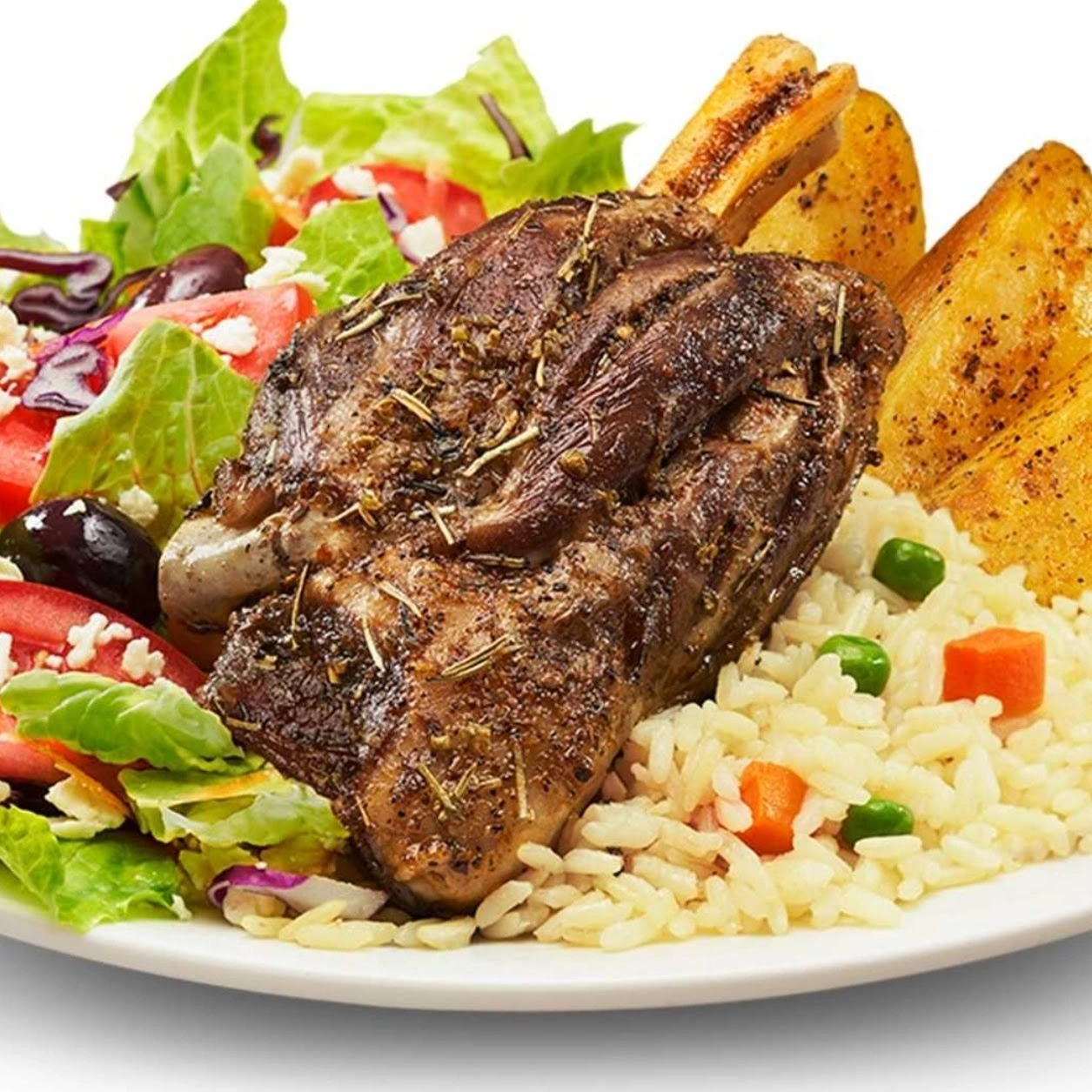 Slow-braised halal lamb shank with rice and roasted potatoes at Donair and Poutine House in Edmonton, AB